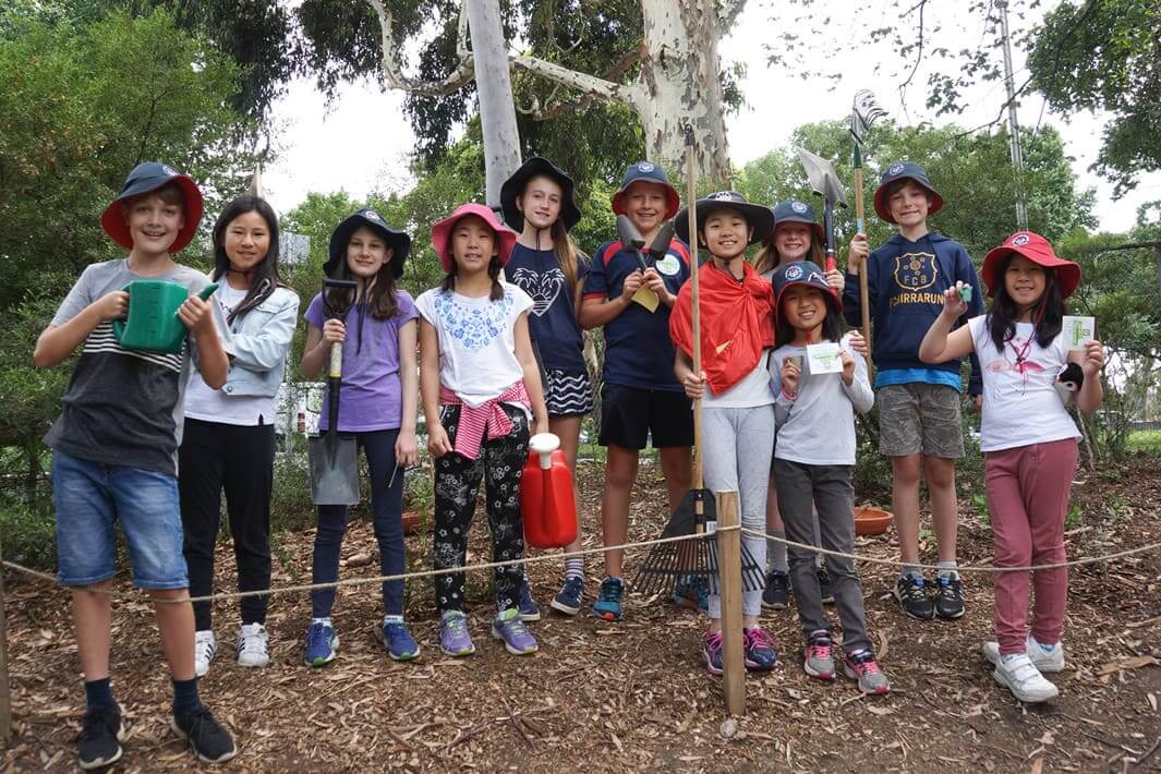 Young students in front of bird habitat
