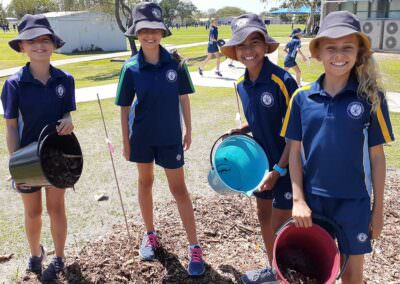 Group of school children working on outdoor learning project