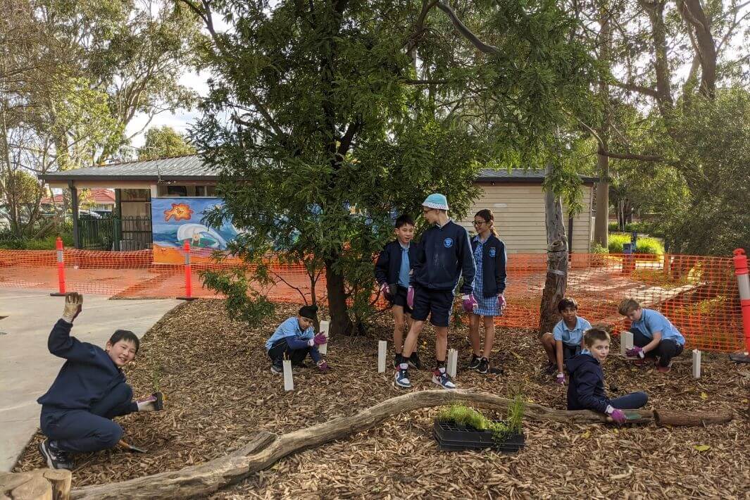 Group of students building bird nest boxes