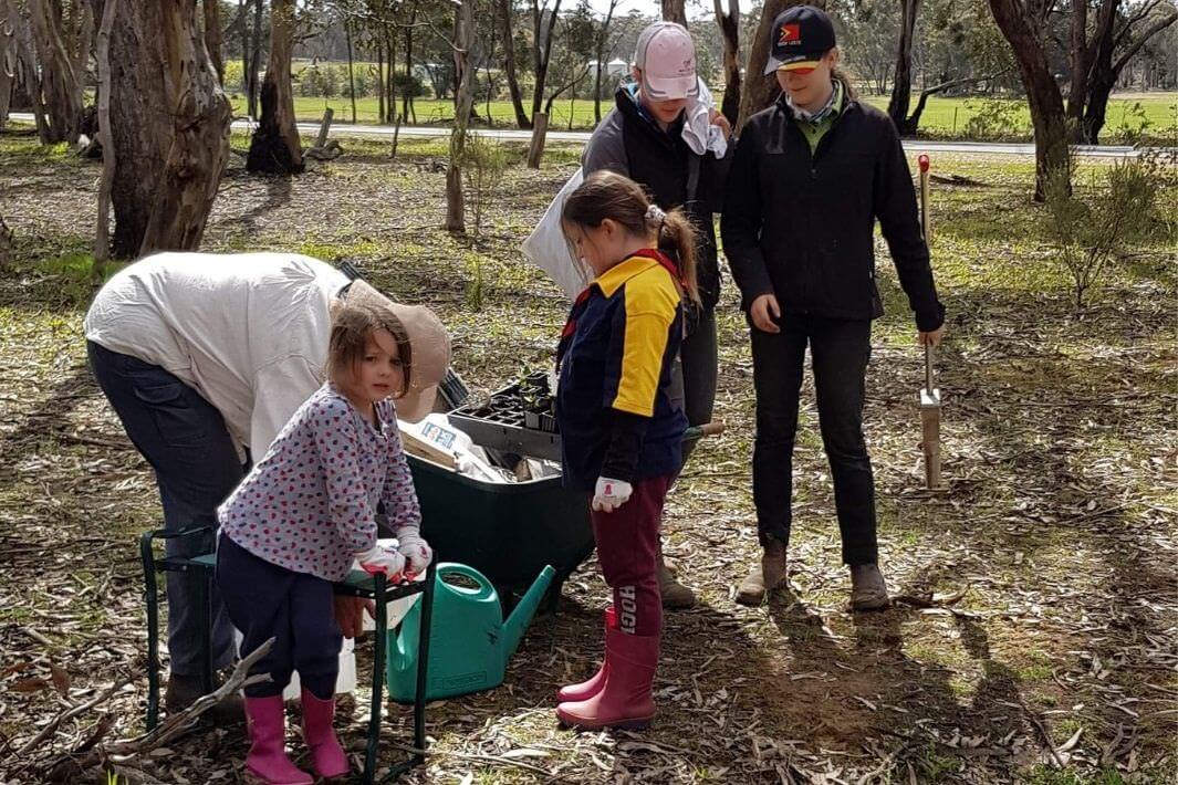 young students working on junior landcare