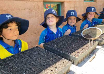Geraldton Grammar Kindy Students with native seedlings